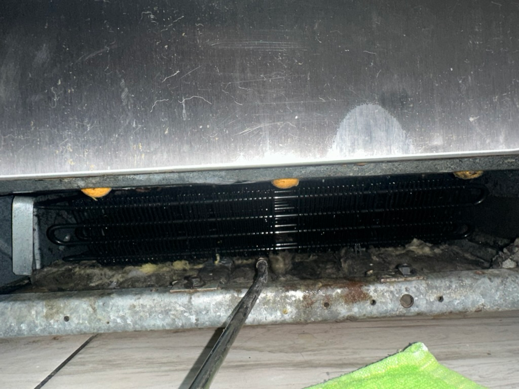 Refrigerator condenser during maintenance